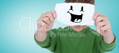 Composite image of man holding blank paper in front on face