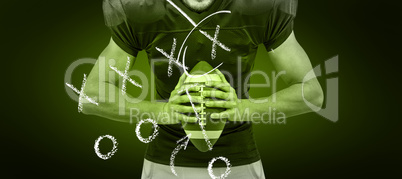 Composite image of aggressive american football player holding b