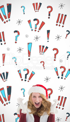 Composite image of blonde woman in santa hat screaming at camera
