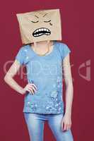 Composite image of woman posing with bag on head