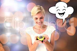 Composite image of attractive woman holding fresh avocado