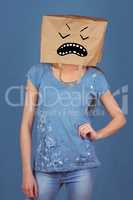 Composite image of woman posing with bag on head