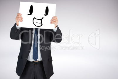 Composite image of mature businessman showing card