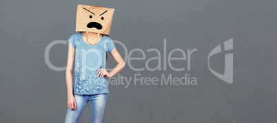 Composite image of woman posing with bag on head