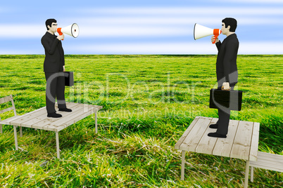 Businessman with megaphone standing on table in the meadow