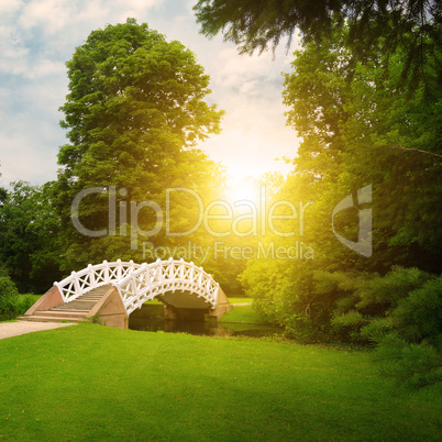 Stone bridge over stream. sunrise