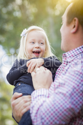 Adorable Little Girl Having Fun With Daddy Outdoors