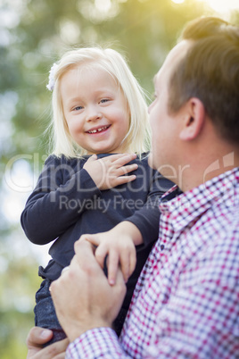 Adorable Little Girl Having Fun With Daddy Outdoors