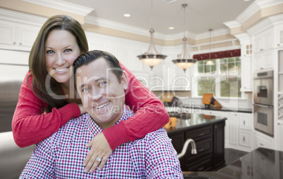 Happy Couple In Beautiful New Kitchen