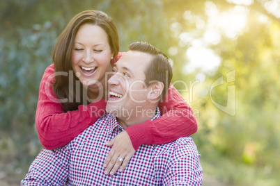 Attractive Caucasian Couple Laughing Outdoors