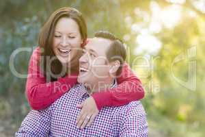 Attractive Caucasian Couple Laughing Outdoors