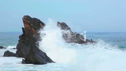 Rock in the Ocean and a Big Wave