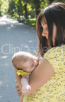 Mother and baby in a park