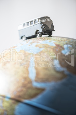 Vintage VW bus on globe
