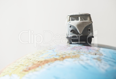 Vintage VW bus on globe