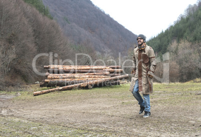 Young man walking in the forest