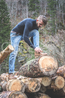 Man tie shoes in the forest