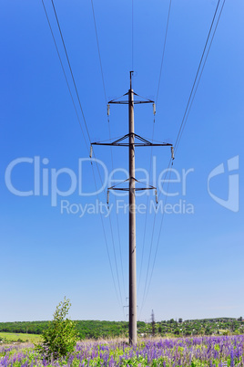 High-voltage electric pole with wires on a background of blue sk