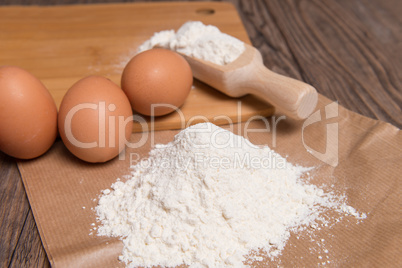 Flour spoon and eggs