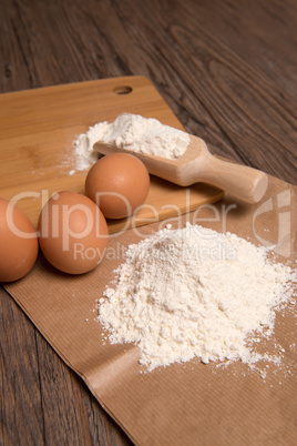 Flour spoon and eggs