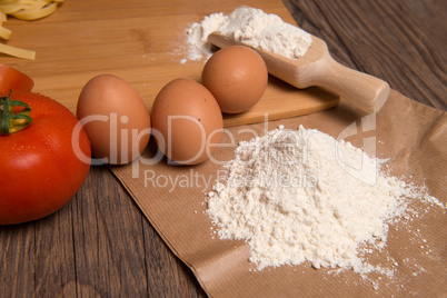 Flour spoon and eggs