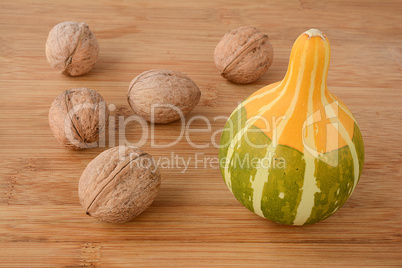 Walnuts and decorative pumpkin