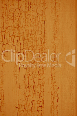 Yellow paint on wood background