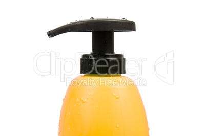 Close up of yellow shampoo bottle cap