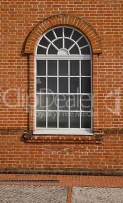 White painted wood arched window