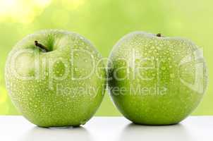 Two fresh green apples