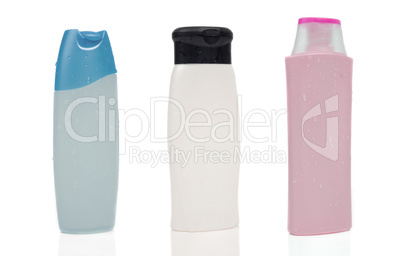 Three blank shampoo bottles