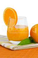 Cup of orange juice and fresh orange