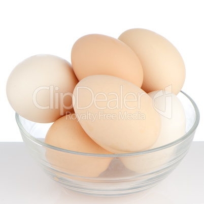 Brown eggs in transparent bowl