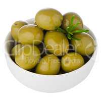 Green olives in a white ceramic bowl