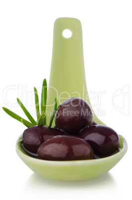 Olives on ceramic spoon