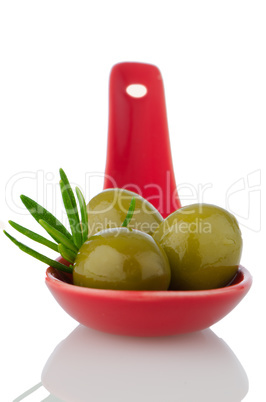 Olives on ceramic spoon