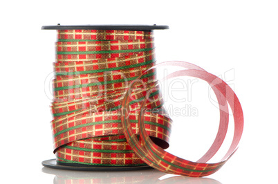 Spool with decorative red ribbon