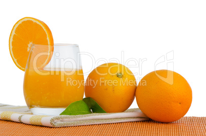 Cup of orange juice and fresh orange