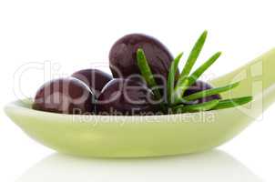 Olives on ceramic spoon