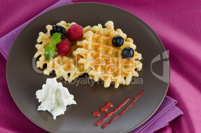 Tasty waffle with fruits