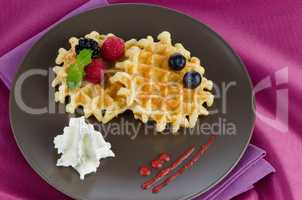 Tasty waffle with fruits