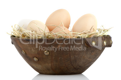 Eggs on wood bowl
