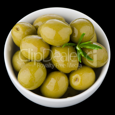 Green olives in a white ceramic bowl