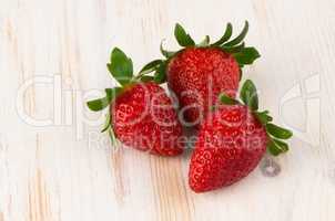 Three fresh strawberries