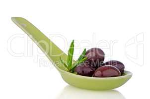 Olives on ceramic spoon