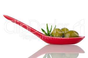 Olives on ceramic spoon