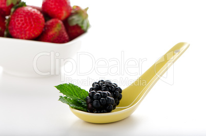 Blackberries in ceramic spoon