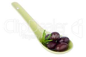 Olives on ceramic spoon