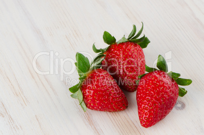 Three fresh strawberries
