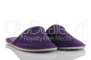 A pair of purple slippers